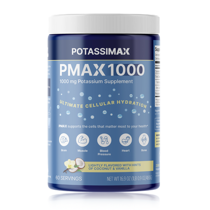 A tub of Potassium Max 1000 dietary supplement on a plain white background. The container is dark blue with a white ribbed cap and a blue label featuring white and yellow text, along with small illustrations of fruit and flowers indicating a lightly flavored coconut and vanilla taste.