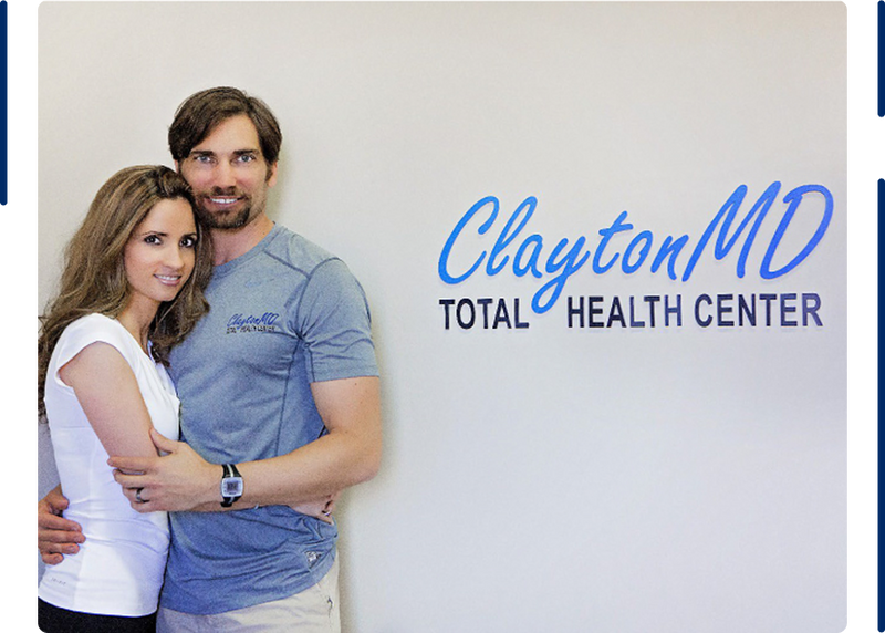 Couple in front of the ClaytonMD Total Health Center sign