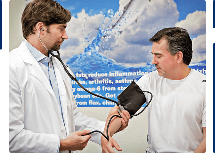 A physician measuring a patient’s blood pressure